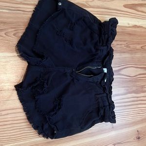 Black jean shorts with rips
